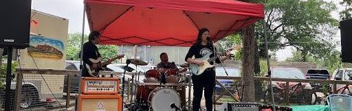 Ama, members of the Austin Federation of Musicians, playing at the May Day Job Fair. Photo credit: Haru L.